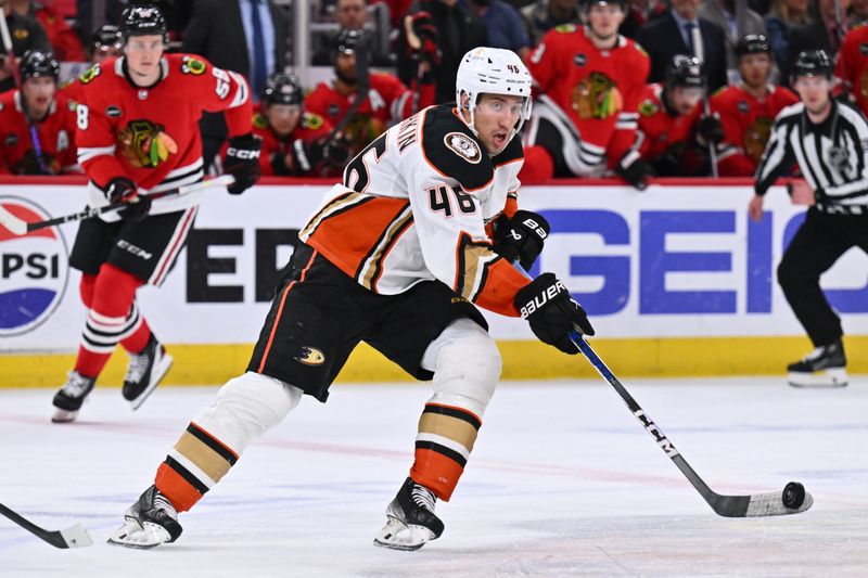 Dec 7, 2023; Chicago, Illinois, USA; Anaheim Ducks defenseman Ilya Lyubushkin (46) passes the puck in the second period against the Chicago Blackhawks at United Center. Mandatory Credit: Jamie Sabau-USA TODAY Sports.