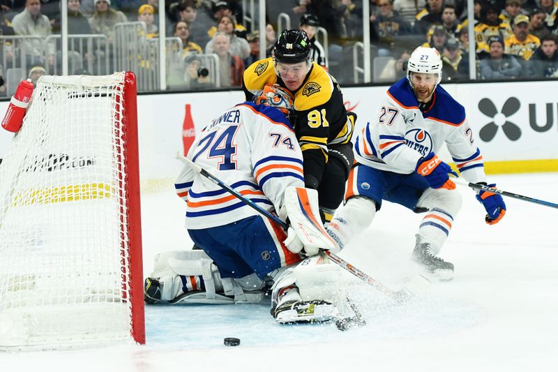 Jan 7, 2025; Boston, Massachusetts, USA;  Edmonton Oilers goaltender Stuart Skinner (74) makes a save on Boston Bruins defenseman Nikita Zadorov (91) during the first period at TD Garden. Mandatory Credit: Bob DeChiara-Imagn Images