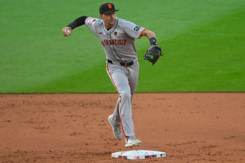 Jul 5, 2024; Cleveland, Ohio, USA; San Francisco Giants shortstop Nick Ahmed (16) turns a double play in the first inning against the Cleveland Guardians at Progressive Field. Mandatory Credit: David Richard-USA TODAY Sports