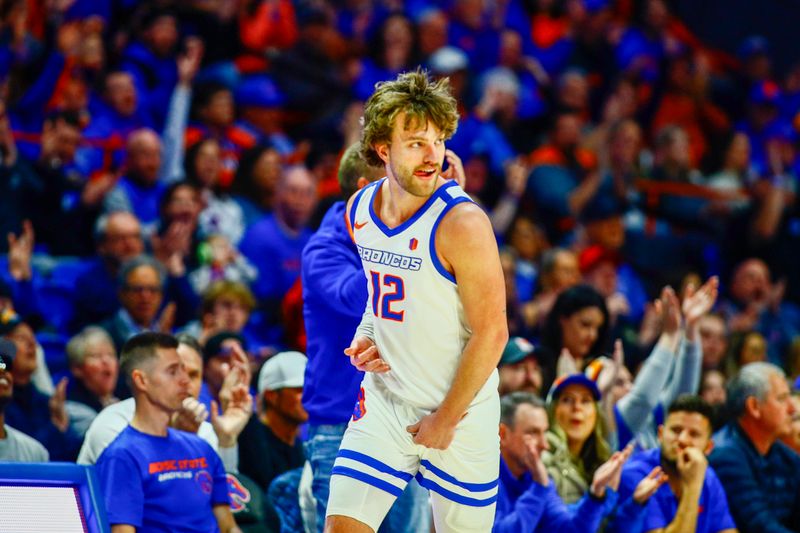 Mar 2, 2024; Boise, Idaho, USA; State Broncos guard Max Rice (12) reacts to a three-point shot during the first half against the New Mexico Lobos at ExtraMile Arena. Mandatory Credit: Brian Losness-USA TODAY Sports


