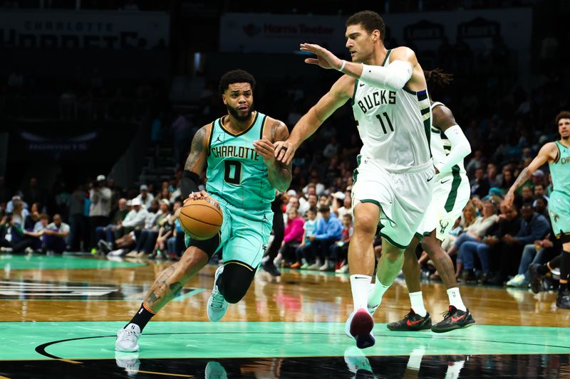 CHARLOTTE, NORTH CAROLINA - NOVEMBER 16: Miles Bridges #0 of the Charlotte Hornets drives by .b11 during the first half of a basketball game at Spectrum Center on November 16, 2024 in Charlotte, North Carolina. (Photo by David Jensen/Getty Images)