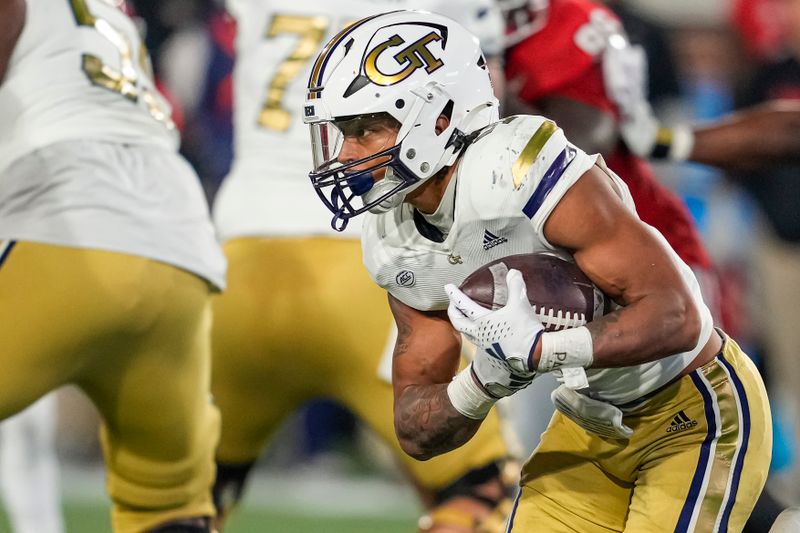 Nov 25, 2023; Atlanta, Georgia, USA; Georgia Tech Yellow Jackets running back Dontae Smith (4) runs against the Georgia Bulldogs at Hyundai Field. Mandatory Credit: Dale Zanine-USA TODAY Sports