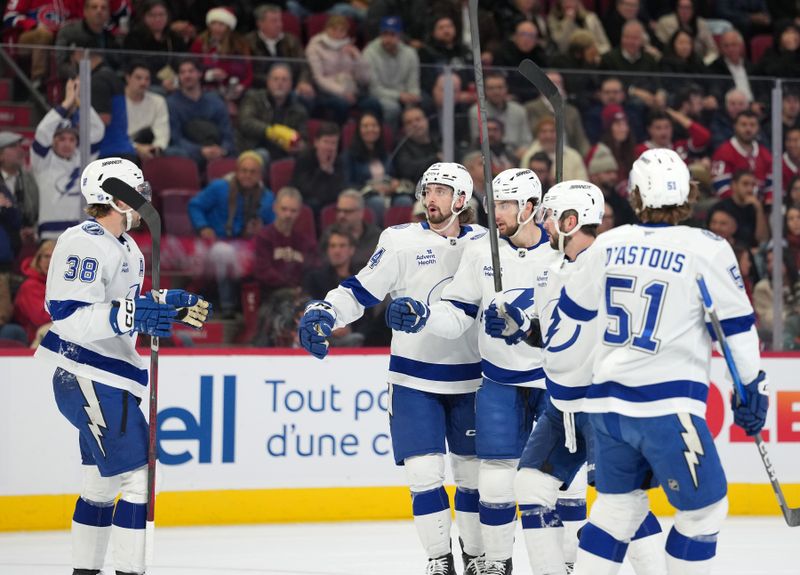 Dec 9, 2025; Montreal, Quebec, CAN; Tampa Bay Lightning forward Nikita Kucherov (86) celebrates with teammates after scoring a goal against the Montreal Canadiens during the first period at the Bell Centre. Mandatory Credit: Eric Bolte-Imagn Images