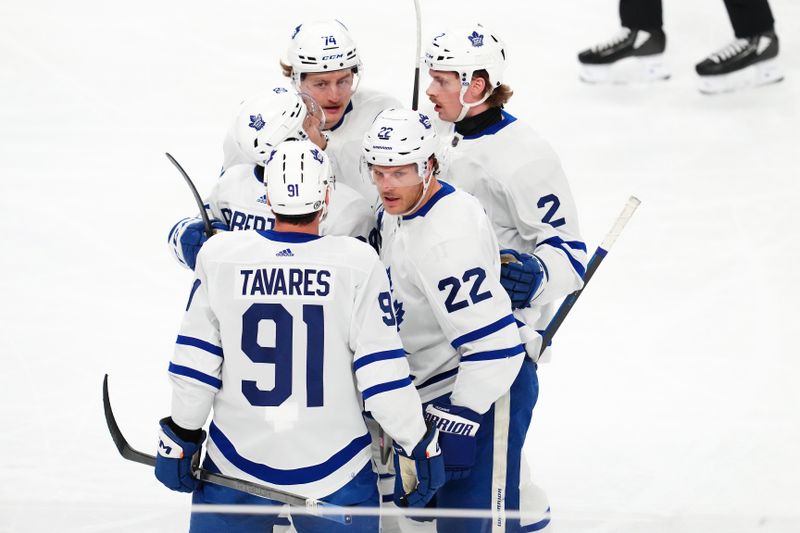 Feb 22, 2024; Las Vegas, Nevada, USA; Toronto Maple Leafs defenseman Jake McCabe (22) celebrates with team mates after scoring a goal against the Vegas Golden Knights during the first period at T-Mobile Arena. Mandatory Credit: Stephen R. Sylvanie-USA TODAY Sports