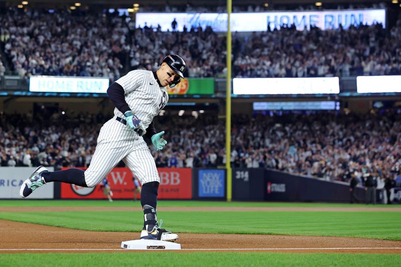 Oct 30, 2024; New York, New York, USA; New York Yankees outfielder Aaron Judge (99) runs the bases after hitting a three run home run during the first inning against the Los Angeles Dodgers in game four of the 2024 MLB World Series at Yankee Stadium. Mandatory Credit: Brad Penner-Imagn Images