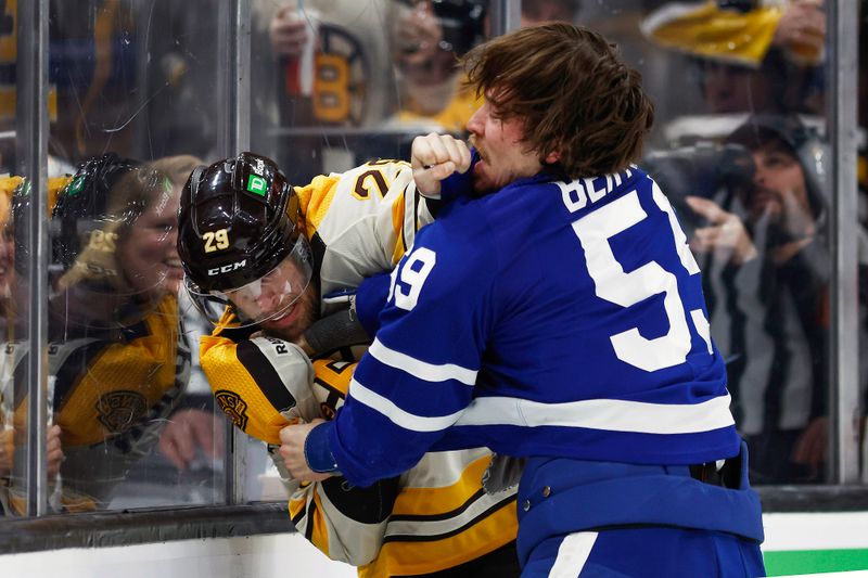 Mar 7, 2024; Boston, Massachusetts, USA; Toronto Maple Leafs left wing Tyler Bertuzzi (59) fights with Boston Bruins defenseman Parker Wotherspoon (29) during the second period at TD Garden. Mandatory Credit: Winslow Townson-USA TODAY Sports