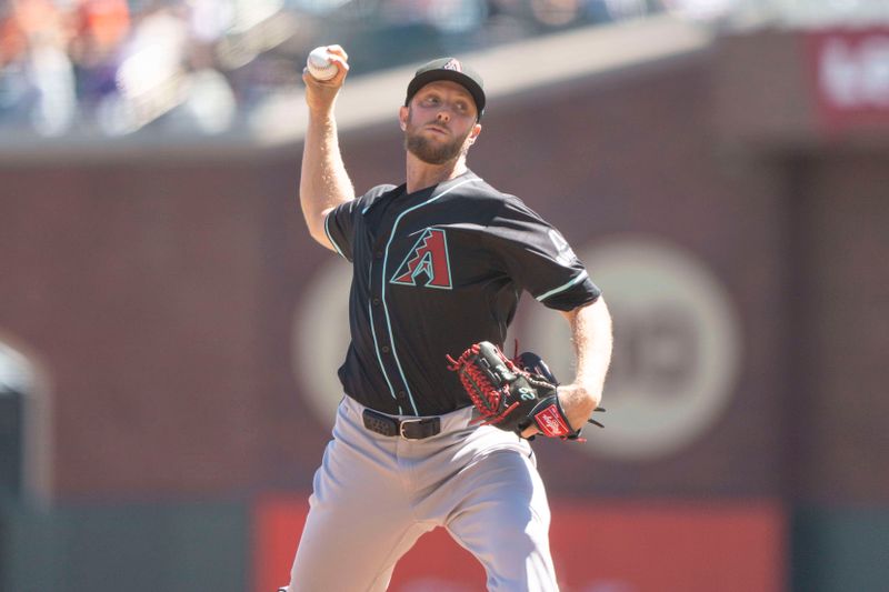 Sep 5, 2024; San Francisco, California, USA;  Arizona Diamondbacks pitcher Merrill Kelly (29) pitches during the second inning against the San Francisco Giants at Oracle Park. Mandatory Credit: Stan Szeto-Imagn Images