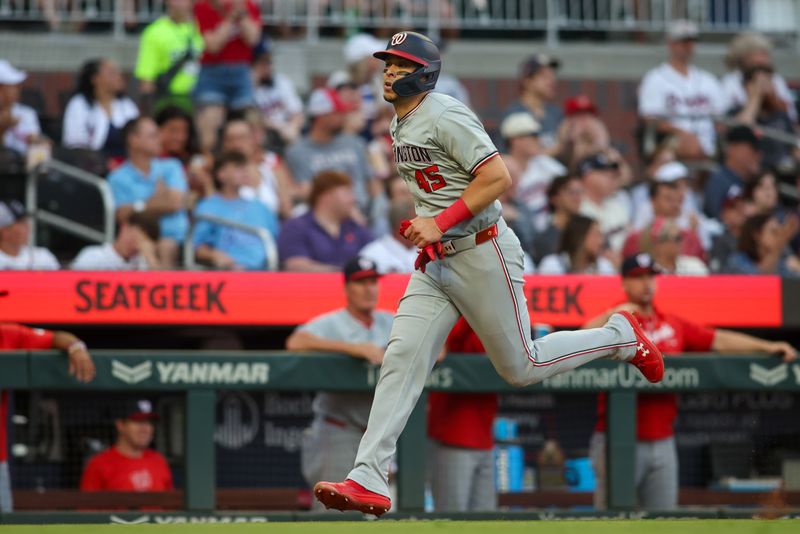 May 30, 2024; Atlanta, Georgia, USA; Washington Nationals first baseman Joey Meneses (45) scores a run against the Atlanta Braves in the third inning at Truist Park. Mandatory Credit: Brett Davis-USA TODAY Sports