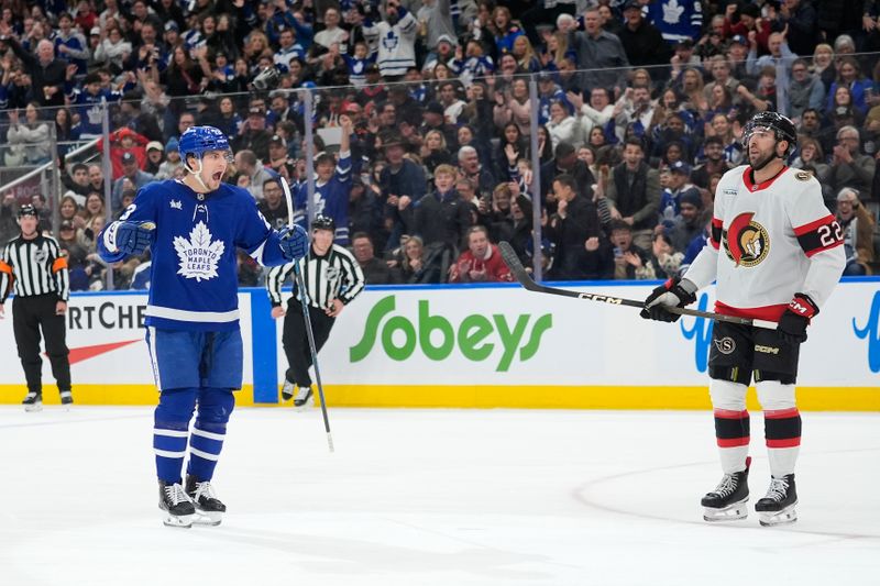 Dec 27, 2025; Toronto, Ontario, CAN; Toronto Maple Leafs forward Matthew Knies (23) reacts after scoring as Ottawa Senators forward Michael Amadio (22) looks on during the first period at Scotiabank Arena. Mandatory Credit: John E. Sokolowski-Imagn Images