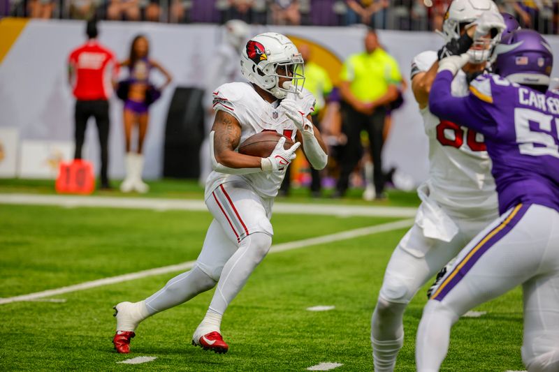 Arizona Cardinals running back Emari Demercado (31) runs the ball against the Minnesota Vikings during the first half of an NFL preseason football game, Saturday, Aug. 26, 2023, in Minneapolis. (AP Photo/Bruce Kluckhohn)