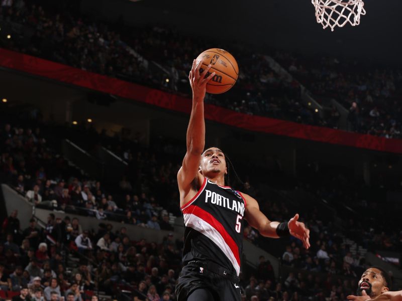 PORTLAND, OR - DECEMBER 1: Dalano Banton #5 of the Portland Trail Blazers drives to the basket during the game against the Dallas Mavericks on December 1, 2024 at the Moda Center Arena in Portland, Oregon. NOTE TO USER: User expressly acknowledges and agrees that, by downloading and or using this photograph, user is consenting to the terms and conditions of the Getty Images License Agreement. Mandatory Copyright Notice: Copyright 2024 NBAE (Photo by Cameron Browne/NBAE via Getty Images)