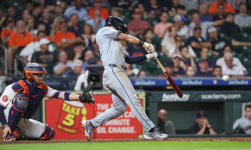 May 1, 2024; Houston, Texas, USA;  Cleveland Guardians left fielder Steven Kwan (38) hits an RBI double during the tenth inning against the Houston Astros at Minute Maid Park. Mandatory Credit: Troy Taormina-USA TODAY Sports