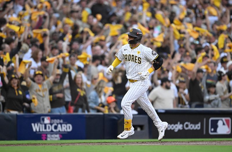 Oct 2, 2024; San Diego, California, USA; San Diego Padres catcher Kyle Higashioka (20) rounds the bases after hitting a solo home run during the second inning of game two in the Wildcard round for the 2024 MLB Playoffs against the Atlanta Braves at Petco Park. Mandatory Credit: Denis Poroy-Imagn Images