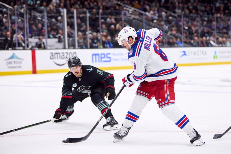 Nov 1, 2025; Seattle, Washington, USA; New York Rangers center J.T. Miller (8) takes a shot as Seattle Kraken center Chandler Stephenson (9) defends during overtime at Climate Pledge Arena. Mandatory Credit: Blake Dahlin-Imagn Images