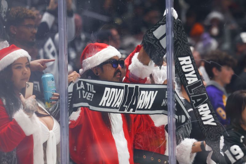 Dec 23, 2023; Los Angeles, California, USA; A Los Angeles Kings fan looks on before a game against the Calgary Flames at Crypto.com Arena. Mandatory Credit: Jessica Alcheh-USA TODAY Sports