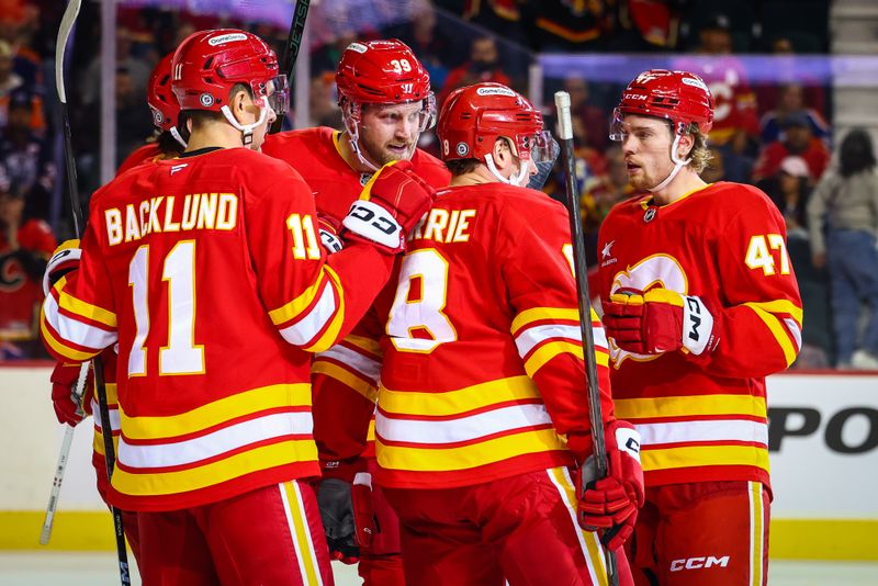 Nov 3, 2024; Calgary, Alberta, CAN; Calgary Flames right wing Anthony Mantha (39) celebrates his goal with teammates against the Edmonton Oilers during the second period at Scotiabank Saddledome. Mandatory Credit: Sergei Belski-Imagn Images