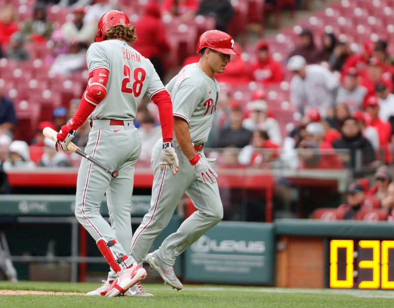 Apr 16, 2023; Cincinnati, Ohio, USA; Philadelphia Phillies catcher J.T. Realmuto (10) reacts with first baseman Alec Bohm (28) after hitting a solo home run against the Cincinnati Reds during the seventh inning at Great American Ball Park. Mandatory Credit: David Kohl-USA TODAY Sports