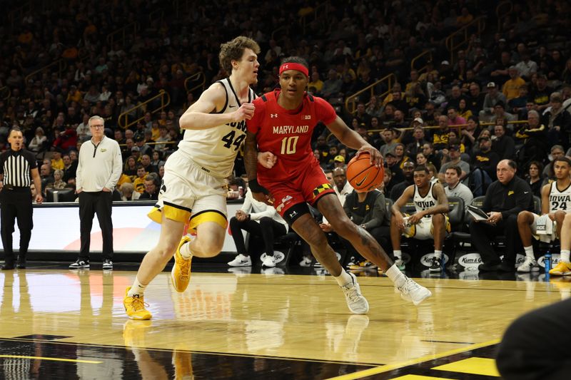 Jan 15, 2023; Iowa City, Iowa, USA; Iowa Hawkeyes forward Riley Mulvey (44) defended Maryland Terrapins forward Julian Reese (10) at Carver-Hawkeye Arena. Mandatory Credit: Reese Strickland-USA TODAY Sports