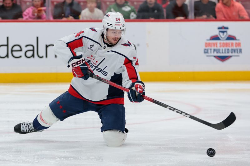 Nov 13, 2025; Sunrise, Florida, USA; Washington Capitals center Connor McMichael (24) dives for the puck against the Florida Panthers during the second period at Amerant Bank Arena. Mandatory Credit: Sam Navarro-Imagn Images