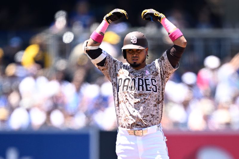 May 12, 2024; San Diego, California, USA; San Diego Padres designated hitter Luis Arraez (4) celebrates after hitting a double against the Los Angeles Dodgers during the second inning at Petco Park. Mandatory Credit: Orlando Ramirez-USA TODAY Sports