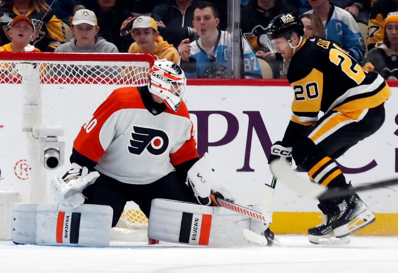 Feb 25, 2024; Pittsburgh, Pennsylvania, USA;  Philadelphia Flyers goaltender Cal Petersen (40) makes a save against Pittsburgh Penguins center Lars Eller (20) during the third period at PPG Paints Arena. Pittsburgh won 7-6. Mandatory Credit: Charles LeClaire-USA TODAY Sports