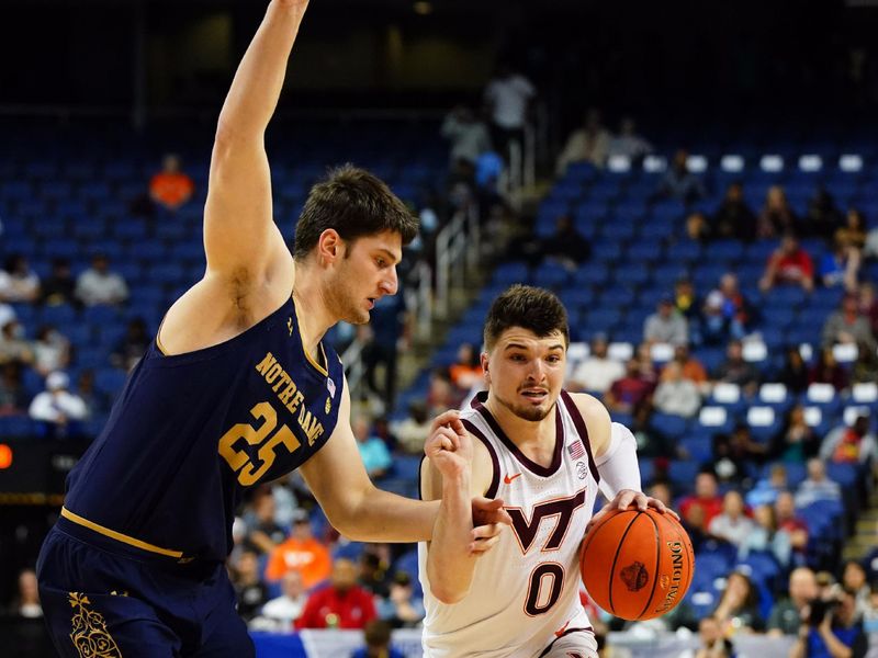 Mar 7, 2023; Greensboro, NC, USA; Virginia Tech Hokies guard Hunter Cattoor (0) drives to the lane against Notre Dame Fighting Irish forward Matt Zona (25) during the first half of the first round of the ACC tournament at Greensboro Coliseum. Mandatory Credit: John David Mercer-USA TODAY Sports