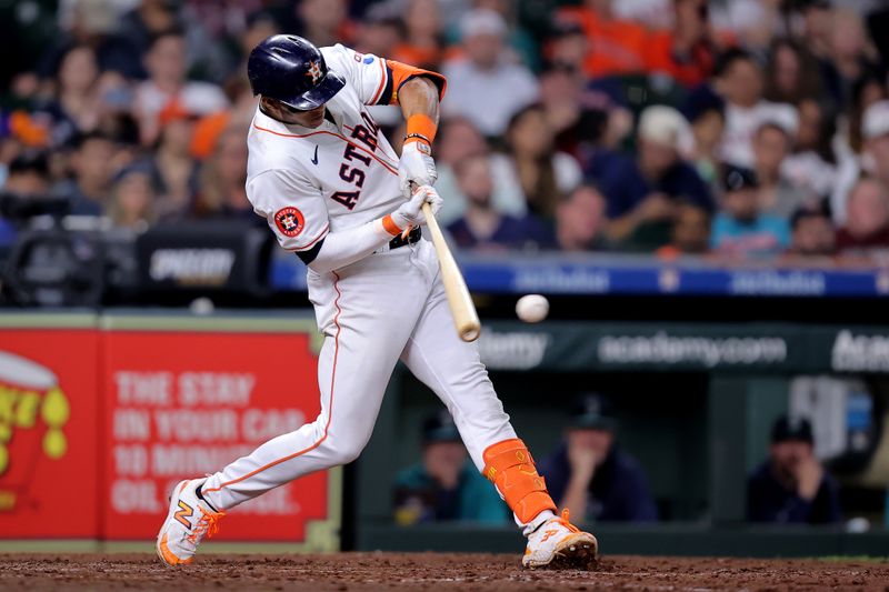 May 5, 2024; Houston, Texas, USA; Houston Astros shortstop Jeremy Pena (3) hits a single against the Seattle Mariners during the seventh inning at Minute Maid Park. Mandatory Credit: Erik Williams-USA TODAY Sports