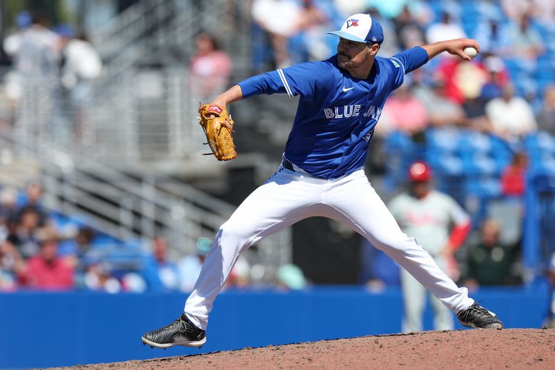 Mar 21, 2025; Dunedin, Florida, USA; Toronto Blue Jays pitcher Brendon Little (54) throws a pitch against the Philadelphia Phillies in the eighth inning during spring training at TD Ballpark. Mandatory Credit: Nathan Ray Seebeck-Imagn Images