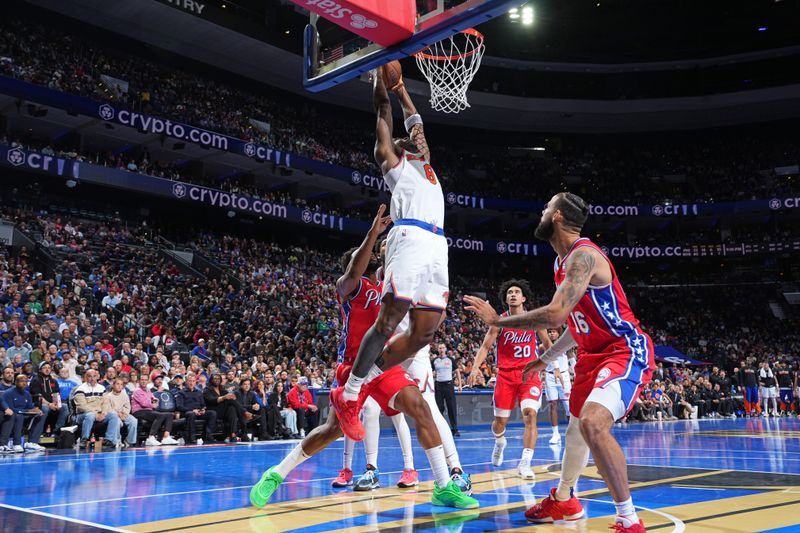 PHILADELPHIA, PA - NOVEMBER 12: OG Anunoby #8 of the New York Knicks rebounds the ball during the game against the Philadelphia 76ers during the Emirates NBA Cup game on November 12, 2024 at the Wells Fargo Center in Philadelphia, Pennsylvania NOTE TO USER: User expressly acknowledges and agrees that, by downloading and/or using this Photograph, user is consenting to the terms and conditions of the Getty Images License Agreement. Mandatory Copyright Notice: Copyright 2024 NBAE (Photo by Jesse D. Garrabrant/NBAE via Getty Images)