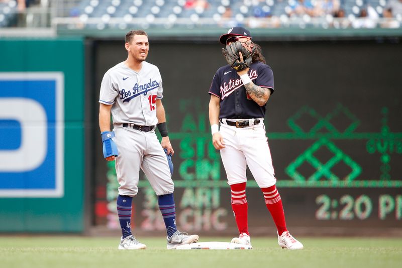 Sep 10, 2023; Washington, District of Columbia, USA; Washington Nationals second baseman Michael Chavis (6) talks to Los Angeles Dodgers catcher Will Smith (16) during a stoppage in play in the second inning at Nationals Park. Mandatory Credit: Amber Searls-USA TODAY Sports