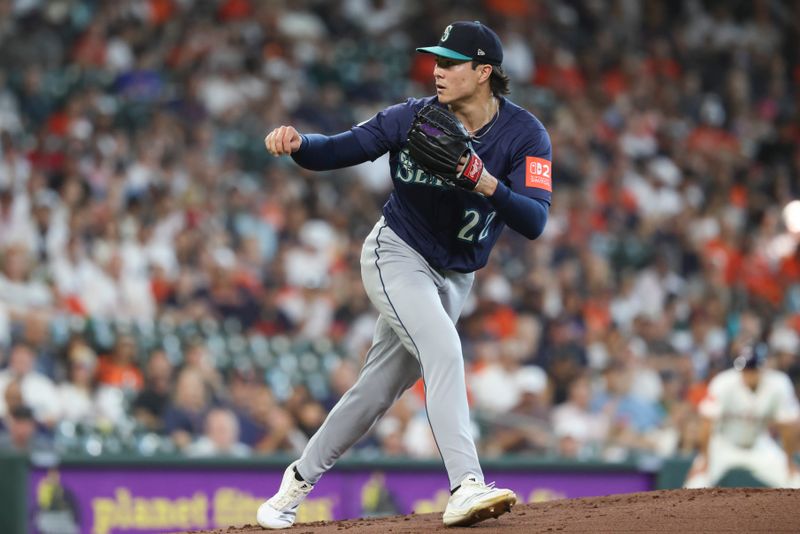 May 24, 2025; Houston, Texas, USA; Seattle Mariners starting pitcher Bryan Woo (22) delivers a pitch during the first inning against the Houston Astros at Daikin Park. Mandatory Credit: Troy Taormina-Imagn Images