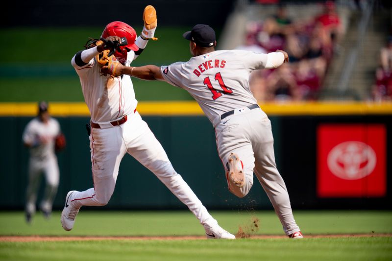 Jun 22, 2024; Cincinnati, Ohio, USA; Boston Red Sox third baseman Rafael Devers (11) tags out Cincinnati Reds shortstop Elly De La Cruz (44) in the fifth inning of the MLB baseball game between the Cincinnati Reds and the Boston Red Sox at Great American Ball Park in Cincinnati on Saturday, June 22, 2024. Mandatory Credit: Albert Cesare-The Cincinnati Enquirer-USA TODAY Sports