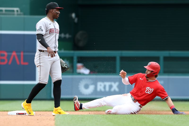 Apr 6, 2025; Washington, District of Columbia, USA; Washington Nationals outfielder Dylan Crews (3) slides safely into second base during the fourth inning against the Arizona Diamondbacks at Nationals Park. Mandatory Credit: Daniel Kucin Jr.-Imagn Images