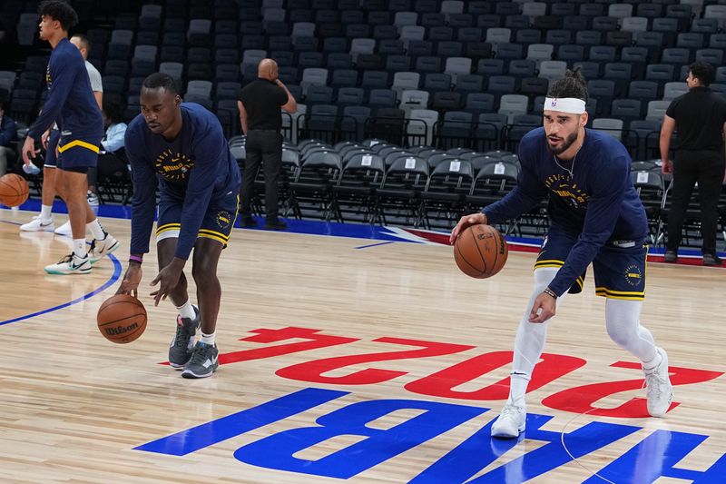 ABU DHABI, UAE - OCTOBER 6: Jaylin Williams #10 and Gabe McGlothan #30 of the Denver Nuggets warm up before the game against the Boston Celtics during the 2024 Global Games on October 6, 2024 at the Etihad Arena in Abu Dhabi, United Arab Emirates. NOTE TO USER: User expressly acknowledges and agrees that, by downloading and/or using this Photograph, user is consenting to the terms and conditions of the Getty Images License Agreement. Mandatory Copyright Notice: Copyright 2024 NBAE (Photo by Garrett Ellwood/NBAE via Getty Images)