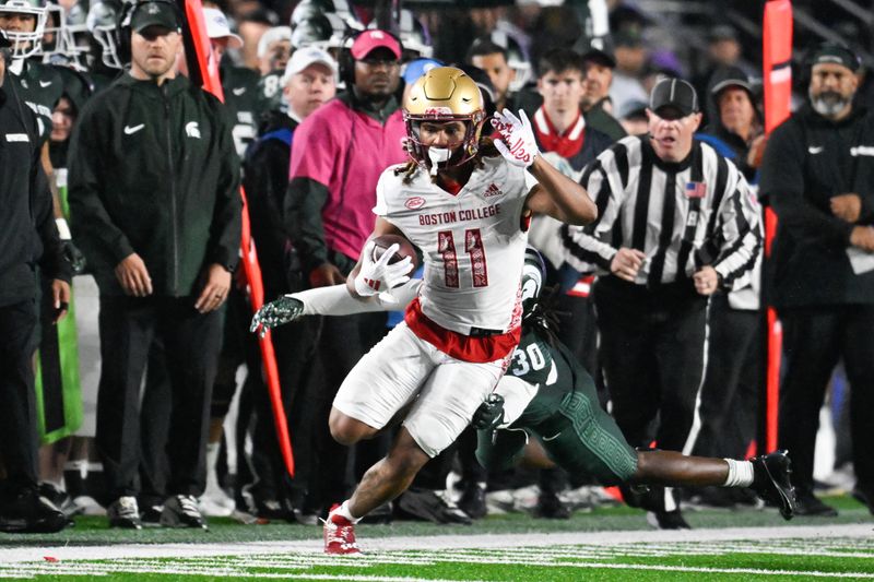 Sep 21, 2024; Chestnut Hill, Massachusetts, USA; Boston College Eagles wide receiver Lewis Bond (11) runs the ball against the Michigan State Spartans during the second half at Alumni Stadium. Mandatory Credit: Eric Canha-Imagn Images