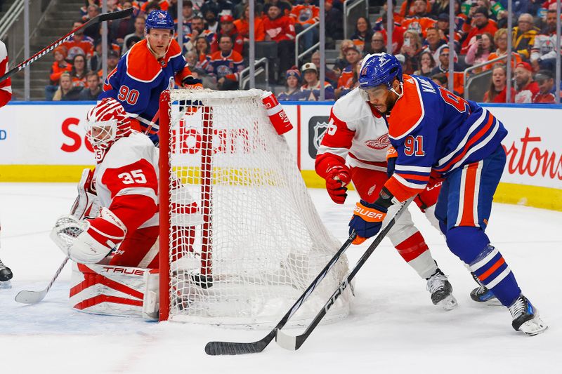 Feb 13, 2024; Edmonton, Alberta, CAN; Edmonton Oilers forward Evander Kane (91) ties to make a pass in front of Detroit Red Wings defensemen Jake Walman (96) during the first period at Rogers Place. Mandatory Credit: Perry Nelson-USA TODAY Sports