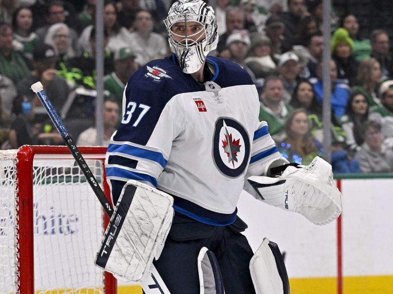 Apr 10, 2025; Dallas, Texas, USA; Winnipeg Jets goaltender Connor Hellebuyck (37) faces the Dallas Stars attack during the second period at the American Airlines Center. Mandatory Credit: Jerome Miron-Imagn Images