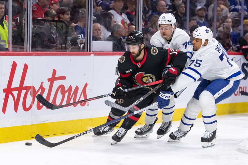 Feb 10, 2024; Ottawa, Ontario, CAN; Ottawa Senators center Mark Kastelic (12) moves the puck away from Toronto Maple Leafs center Bobby McCann (74) and right wing Ryan Reaves (75) in the second period at the Canadian Tire Centre. Mandatory Credit: Marc DesRosiers-USA TODAY Sports