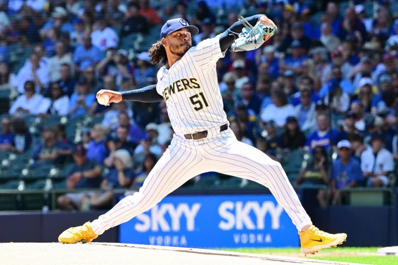 Jun 30, 2024; Milwaukee, Wisconsin, USA; Milwaukee Brewers starting pitcher Freddy Peralta (51) throws a pitch against the Chicago Cubs in the first inning at American Family Field. Mandatory Credit: Benny Sieu-USA TODAY Sports