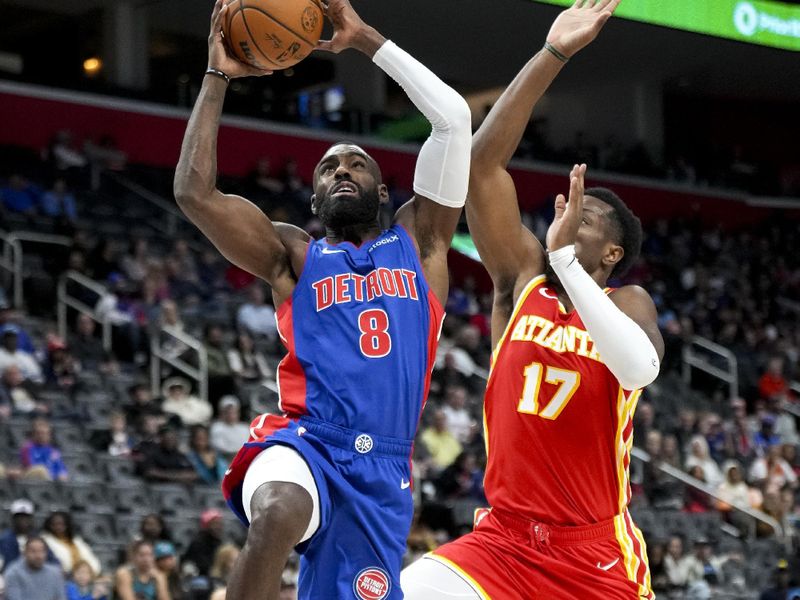 DETROIT, MICHIGAN - NOVEMBER 08: Tim Hardaway Jr. #8 of the Detroit Pistons shoots the ball against Onyeka Okongwu #17 of the Atlanta Hawks during the third quarter at Little Caesars Arena on November 08, 2024 in Detroit, Michigan. NOTE TO USER: User expressly acknowledges and agrees that, by downloading and or using this photograph, User is consenting to the terms and conditions of the Getty Images License Agreement. (Photo by Nic Antaya/Getty Images)