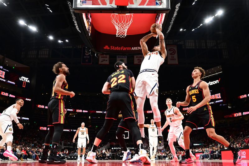 ATLANTA, GA - DECEMBER 8: Michael Porter Jr. #1 of the Denver Nuggets drives to the basket during the game against the Atlanta Hawks on December 8, 2024 at State Farm Arena in Atlanta, Georgia.  NOTE TO USER: User expressly acknowledges and agrees that, by downloading and/or using this Photograph, user is consenting to the terms and conditions of the Getty Images License Agreement. Mandatory Copyright Notice: Copyright 2024 NBAE (Photo by Adam Hagy/NBAE via Getty Images)