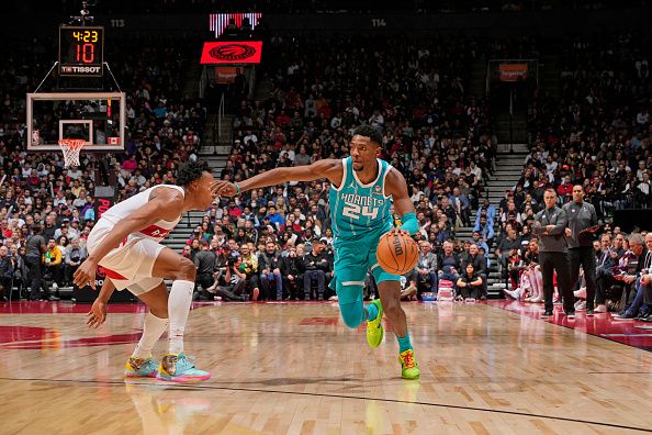 TORONTO, CANADA - DECEMBER 18: Brandon Miller #24 of the Charlotte Hornets dribbles the ball during the game against the Toronto Raptors on December 18, 2023 at the Scotiabank Arena in Toronto, Ontario, Canada.  NOTE TO USER: User expressly acknowledges and agrees that, by downloading and or using this Photograph, user is consenting to the terms and conditions of the Getty Images License Agreement.  Mandatory Copyright Notice: Copyright 2023 NBAE (Photo by Mark Blinch/NBAE via Getty Images)