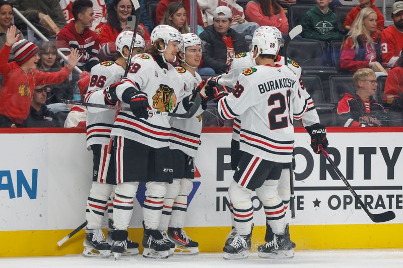 Nov 9, 2025; Detroit, Michigan, USA; Chicago Blackhawks center Connor Bedard (98) celebrates with teammates after scoring a goal in the first period at Little Caesars Arena. Mandatory Credit: Brian Bradshaw Sevald-Imagn Images
