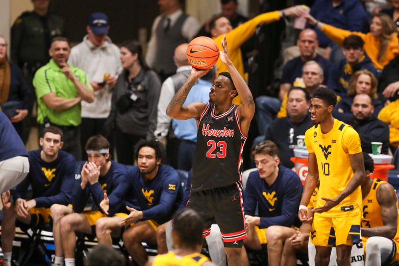 Jan 29, 2025; Morgantown, West Virginia, USA; Houston Cougars guard Terrance Arceneaux (23) shoots a three pointe basket during the first half against the West Virginia Mountaineers at WVU Coliseum. Mandatory Credit: Ben Queen-Imagn Images