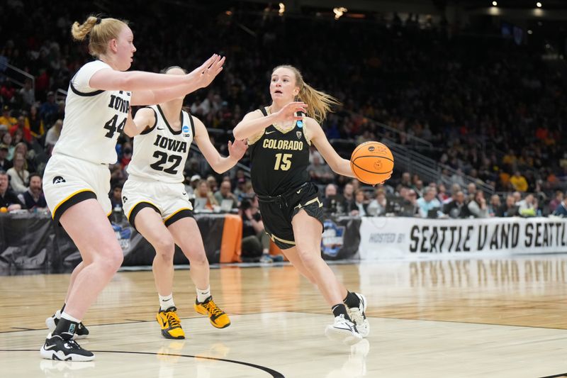 Mar 24, 2023; Seattle, WA, USA; Colorado Buffaloes guard Kindyll Wetta (15) shoots the ball against Iowa Hawkeyes forward Addison O'Grady (44) and guard Caitlin Clark (22) in the second half at Climate Pledge Arena. Mandatory Credit: Kirby Lee-USA TODAY Sports