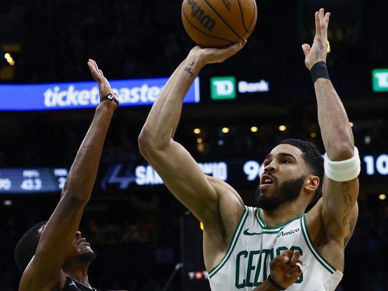 BOSTON, MA - FEBRUARY 12: Jayson Tatum #0 of the Boston Celtics shoots over De'Aaron Fox #4 of the San Antonio Spurs during the second half at TD Garden on February 12, 2025 in Boston, Massachusetts. NOTE TO USER: User expressly acknowledges and agrees that, by downloading and/or using this Photograph, user is consenting to the terms and conditions of the Getty Images License Agreement. (Photo By Winslow Townson/Getty Images)