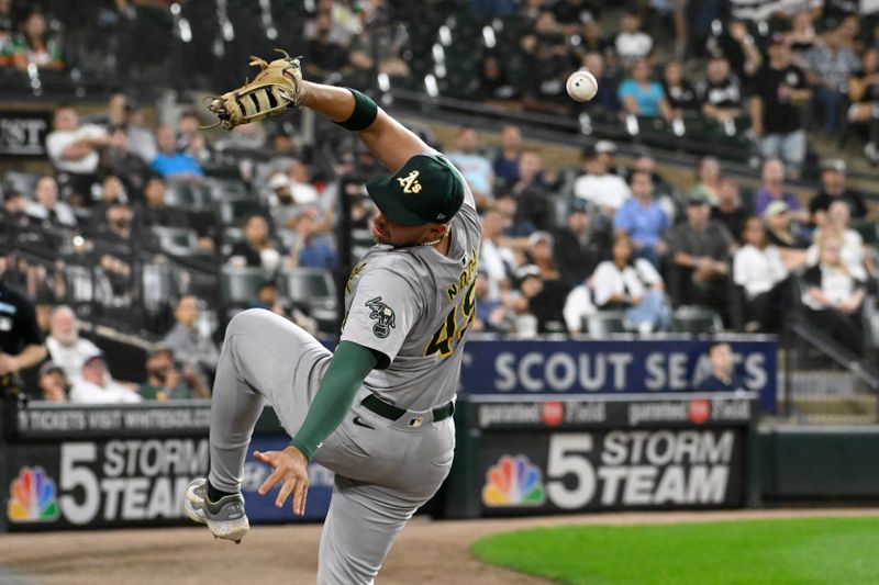 Sep 13, 2024; Chicago, Illinois, USA;   Oakland Athletics first baseman  Ryan Noda (49) tries to make a play on the foul ball hit by Chicago White Sox third base Lenyn Sosa (50) during the ninth inning at  Guaranteed Rate Field. Mandatory Credit: Matt Marton-Imagn Images