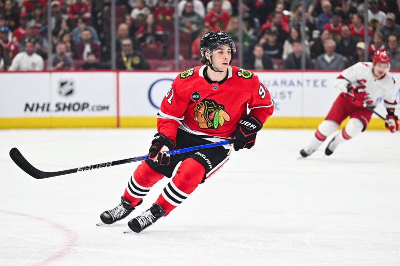 Apr 14, 2024; Chicago, Illinois, USA; Chicago Blackhawks forward Frank Nazar (91) skates in his first NHL game in the first period against the Carolina Hurricanes at United Center. Mandatory Credit: Jamie Sabau-USA TODAY Sports