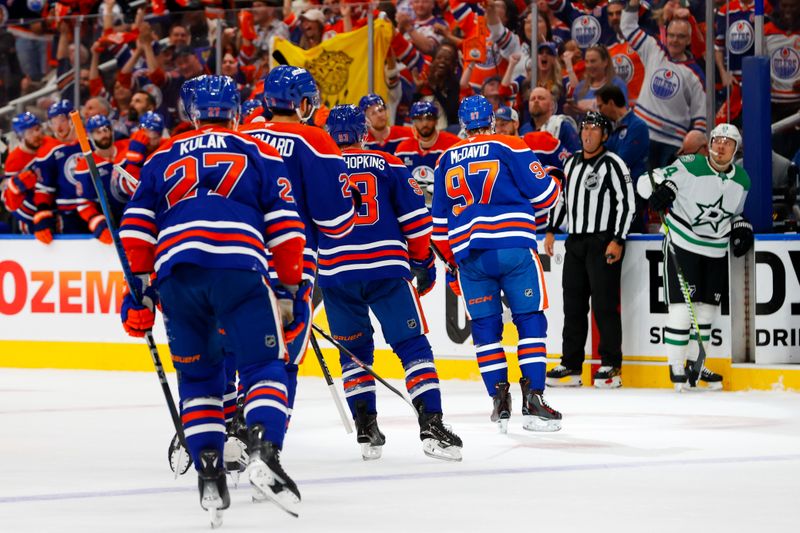May 25, 2025; Edmonton, Alberta, CAN; The Edmonton Oilers celebrates a goal scored by center Connor McDavid (97) against the Dallas Stars during the first period in game three of the Western Conference Final of the 2025 Stanley Cup Playoffs at Rogers Place. Mandatory Credit: Perry Nelson-Imagn Images