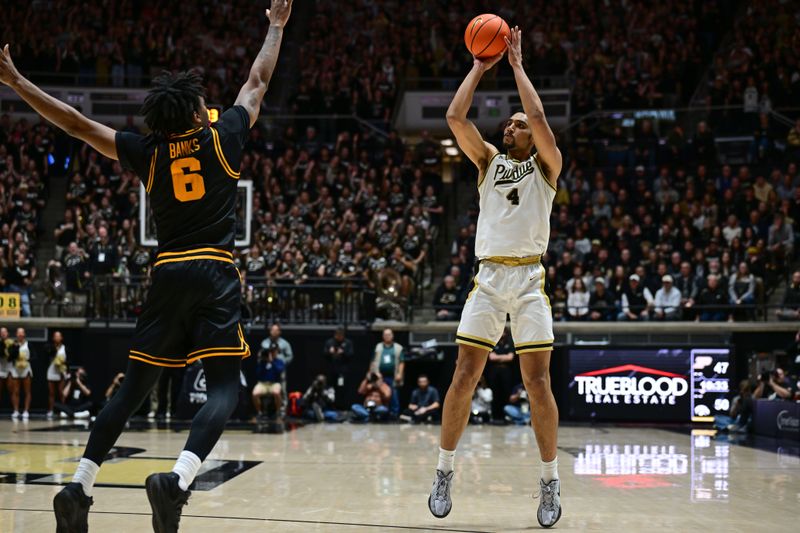 Jan 14, 2026; West Lafayette, Indiana, USA; Purdue Boilermakers forward Trey Kaufman-Renn (4) shoots the ball over Iowa Hawkeyes guard Tavion Banks (6) during the second half at Mackey Arena. Mandatory Credit: Marc Lebryk-Imagn Images